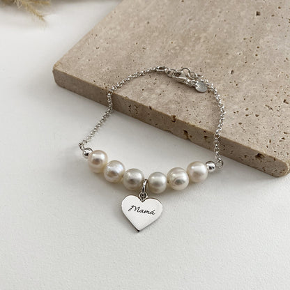 Pulsera perlas x 6 + dije corazón